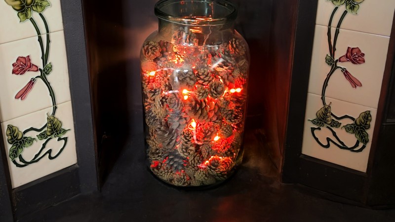 A jar of pine cones that appears to glow like the embers of a fire