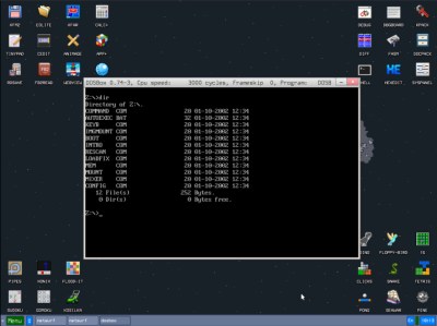 The KolibriOS desktop, with the DOSBox emulator running.