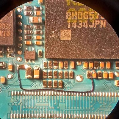 Bodge wire repair on Canon 7D Mark II motherboard