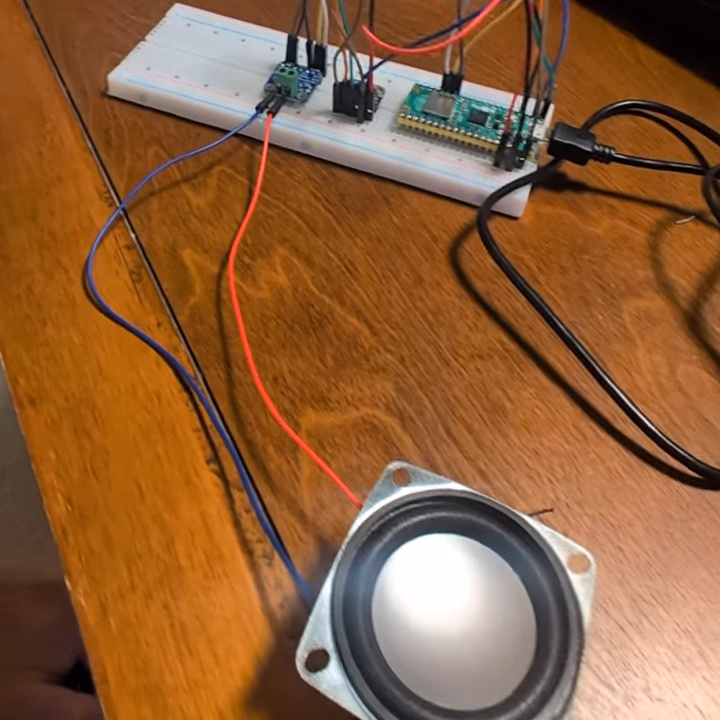 A Raspberry Pi Pico 2 W connected to a speaker