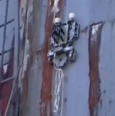 Magnetic crawling robot, climbing up metal wall at the ChNPP. (Credit: ISP NPP)